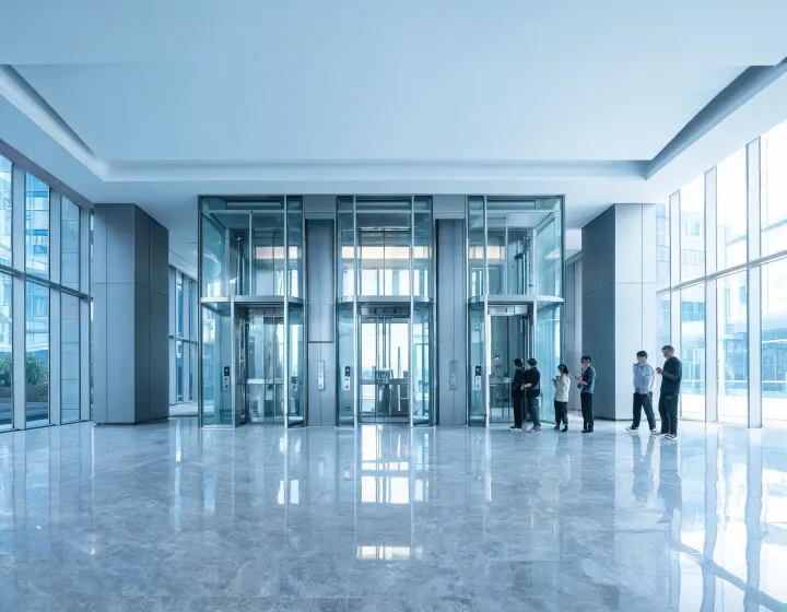 Schindler elevator bank in a glass commercial lobby